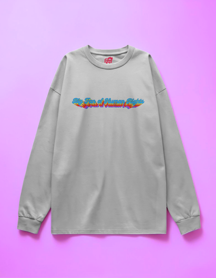 white sweatshirt with colorful text design on a pink background