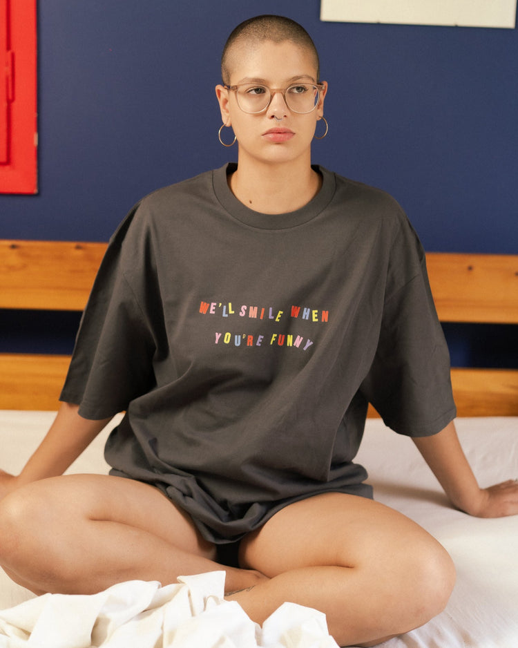 feminist t-shirt with colorful text We'll smile when you're funny
