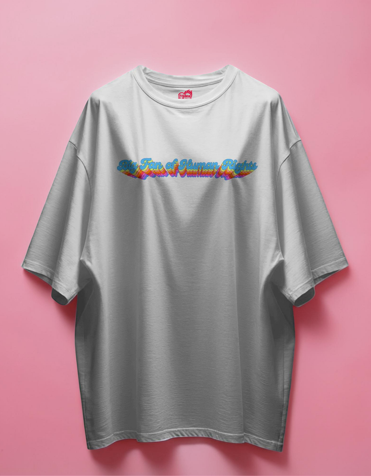 white t-shirt with colorful text design on a pink background