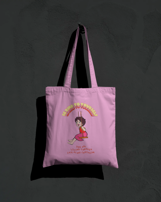 Pink tote bag with cartoon character and text on a dark background