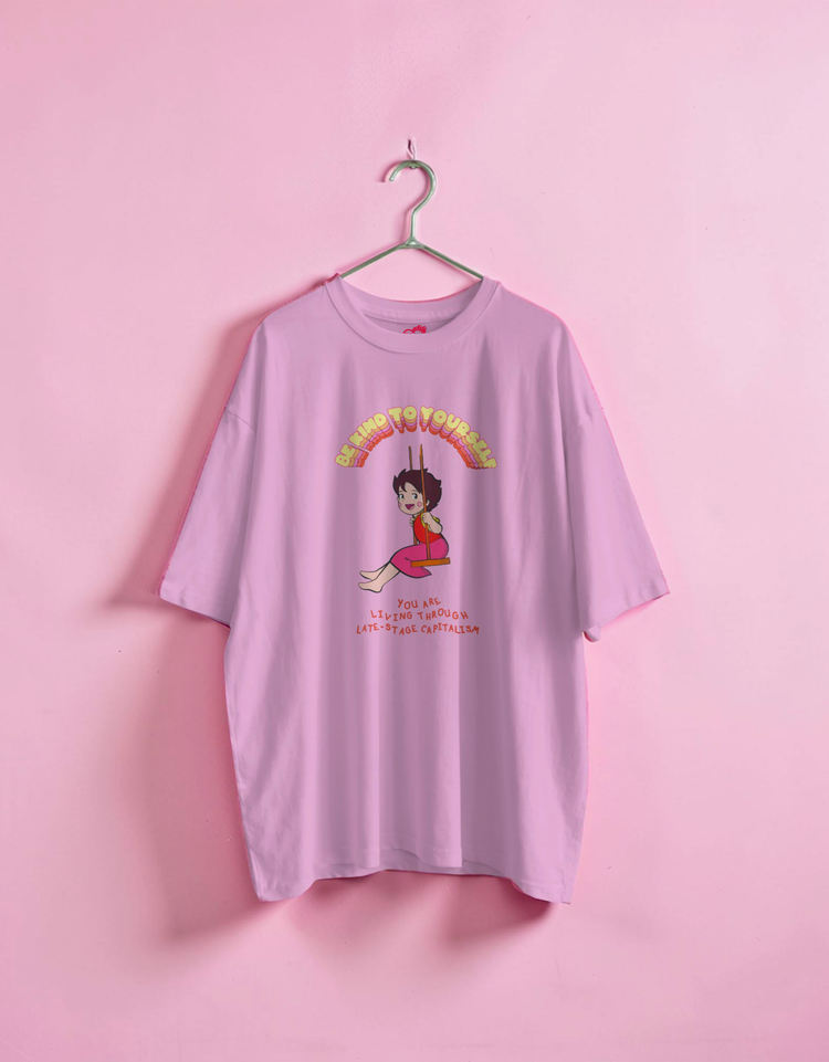 Pink t-shirt with a graphic design on a pink background