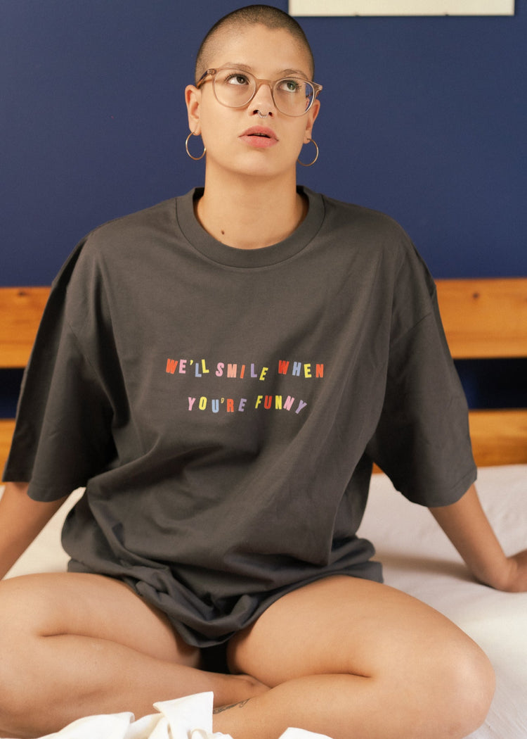 feminist t-shirt with colorful text We'll smile when you're funny