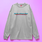 white sweatshirt with colorful text design on a pink background