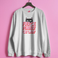 White sweatshirt with 'Fierce Feminist Cat Lady' text and cat graphic on a pink background