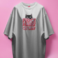white t-shirt with a cat graphic and text on a pink background
