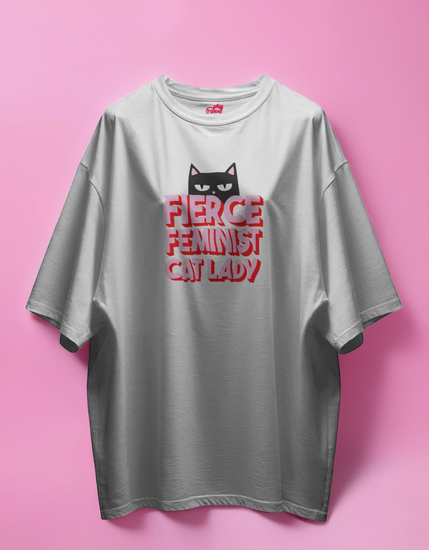 white t-shirt with a cat graphic and text on a pink background