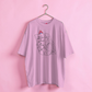 Light purple t-shirt with graphic design on a pink background