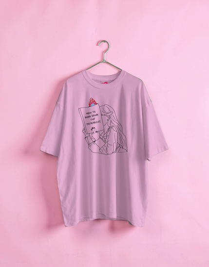 Light purple t-shirt with graphic design on a pink background