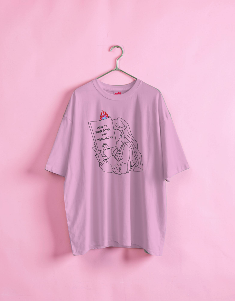 Light purple t-shirt with graphic design on a pink background