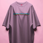pink t-shirt with colorful text design on a pink background