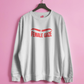 White sweatshirt with 'FEMALE GAZE' text on a pink background