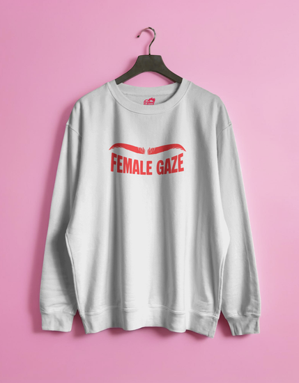 White sweatshirt with 'FEMALE GAZE' text on a pink background
