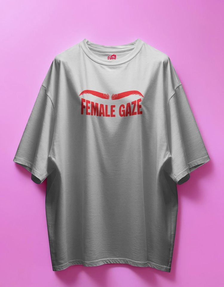 white t-shirt with 'FEMALE GAZE' text on a pink background