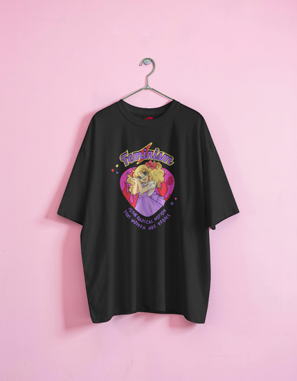 Black t-shirt with colorful graphic design on a pink background