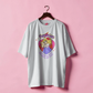 White t-shirt with a graphic design on a pink background