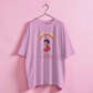 Pink t-shirt with a graphic design on a pink background